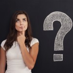Woman with question mark on blackboard